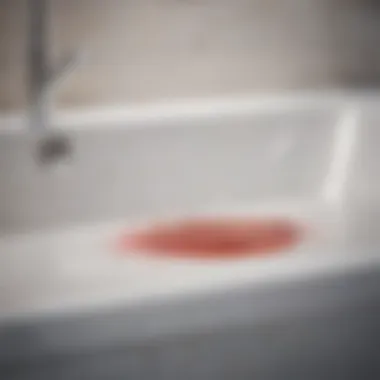 Close-up of a stubborn stain on a bathtub surface