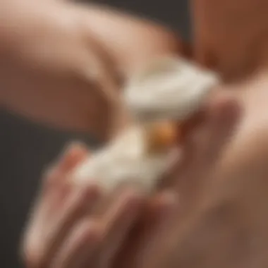 Close-up of a rich, creamy lotion being applied to dry skin