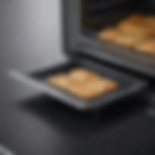 Close-up view of the Breville Smart Oven Air's crumb tray highlighting its design and material.