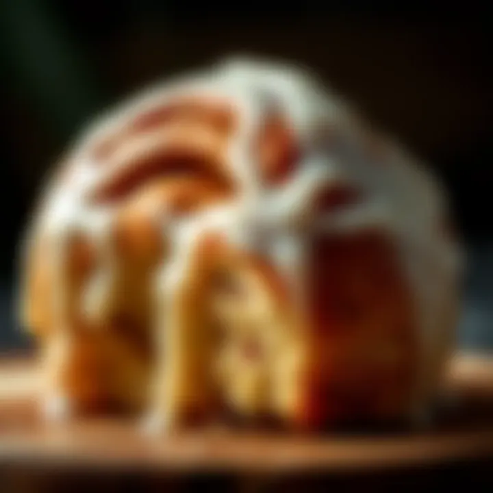 Close-up of gooey cinnamon roll with icing drizzled on top