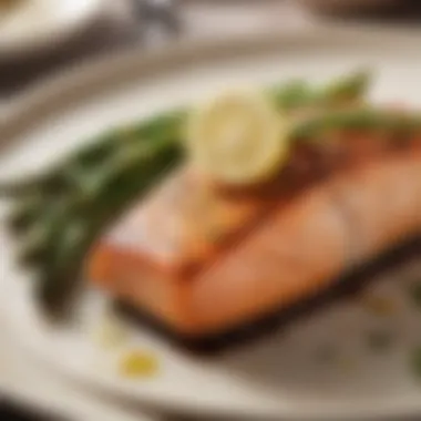 A beautifully plated grilled salmon with a side of steamed asparagus and lemon.