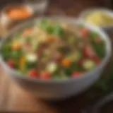 A colorful bowl of quinoa salad topped with fresh vegetables and herbs.