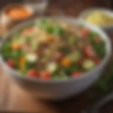 A colorful bowl of quinoa salad topped with fresh vegetables and herbs.
