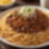 A vibrant dish showcasing Cincinnati's famous chili served over spaghetti, garnished with cheese and onions.