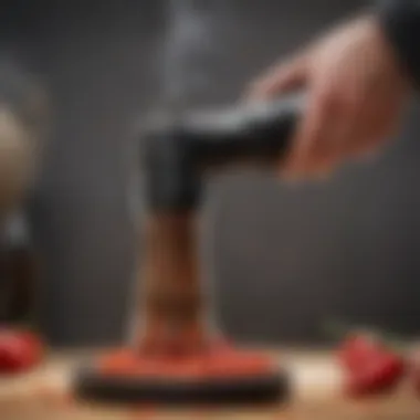 Close-up of electric pepper grinder in action