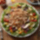 A beautifully arranged grilled chicken salad with fresh vegetables