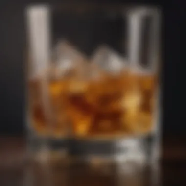 A close-up of whiskey in a glass with ice