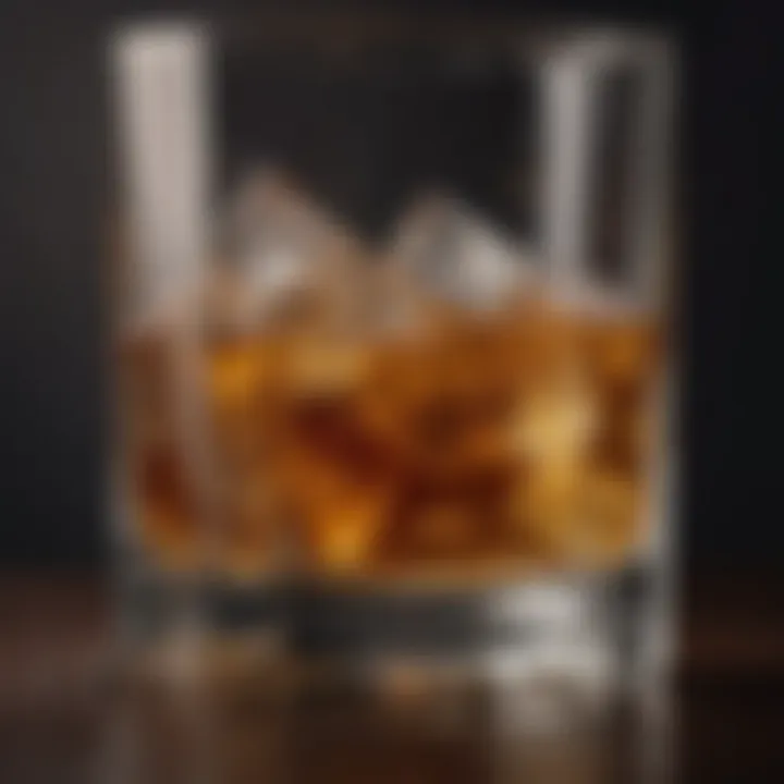 A close-up of whiskey in a glass with ice