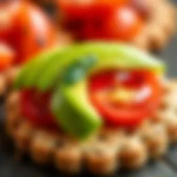A vibrant display of avocado and tomato atop whole grain crackers, emphasizing freshness and flavor.