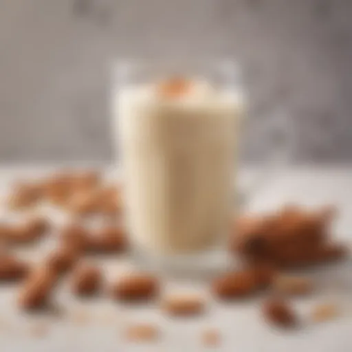 Almond creamer in a glass with almonds and cinnamon