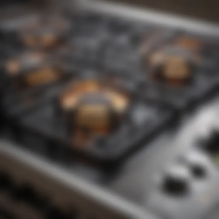 Close-up of a small gas range with unique burner configuration