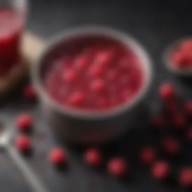 A pot simmering with raspberry mixture