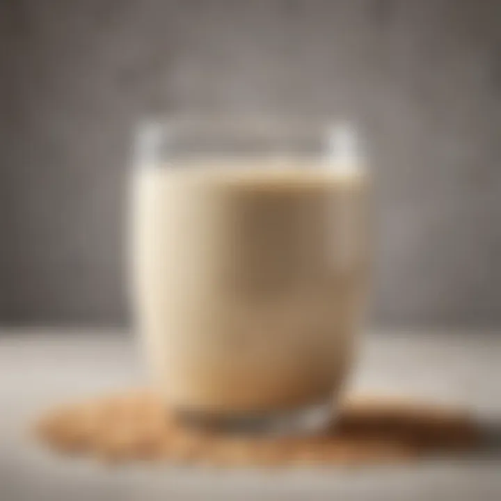 A close-up shot of creamy oat mylk in a stylish glass