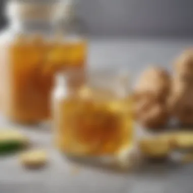 A close-up of ginger extract in a glass jar with fresh ginger nearby