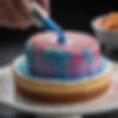 Close-up of gel food coloring being applied to frosting