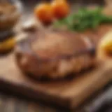 Perfectly grilled pork chop resting on a wooden board