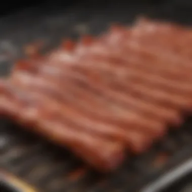 Bacon sizzling in the oven with seasoning