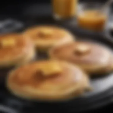 Golden Perfection: Pancakes on Griddle Perfectly golden pancakes on an electric griddle