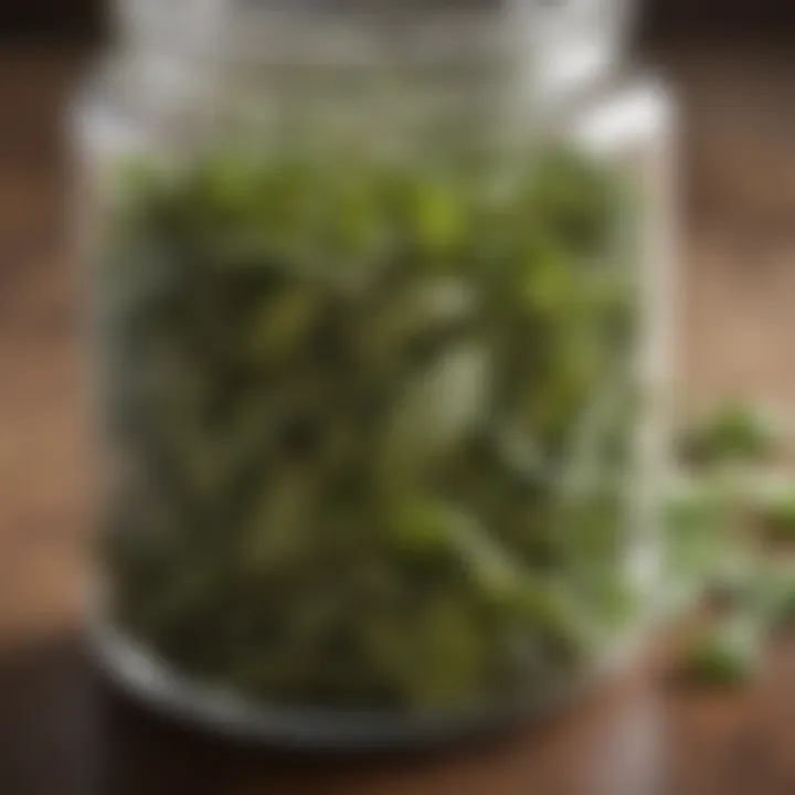 Dried basil leaves displayed in a glass jar