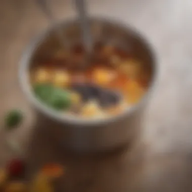 A close-up of a teaspoon measuring cup filled with ingredients