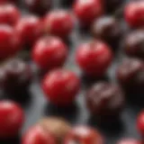 A close-up view of cherry cordial candies showcasing their glossy chocolate exterior and vibrant red cherry filling.